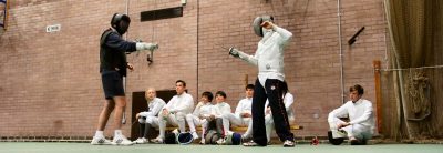 Junior fencers being coaches on a fencing course